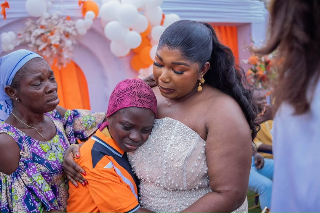 AACF founder comforting a child during a community outreach